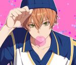  1boy alternate_costume arm_up beanie blonde_hair blue_hat chewing_gum closed_mouth collarbone collared_shirt commentary_request dot_nose earrings green_eyes hair_between_eyes hat highres jewelry korean_commentary looking_at_viewer male_focus multicolored_hair multiple_earrings orange_hair piercing pink_background project_sekai ray_(lthenray) shinonome_akito shirt short_hair solo streaked_hair stud_earrings upper_body wing_collar 