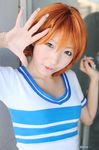  1girl asian cosplay female nami nami_(cosplay) nami_(one_piece) nami_(one_piece)_(cosplay) one_piece orange_hair photo shiriru shirt solo striped striped_shirt t-shirt tshirt 