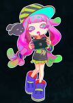  1girl baitong baseball_cap black_background black_shirt bracelet colored_eyelashes drooling fish green_eyes green_skirt handheld_game_console harmony_(splatoon) hat highres holding holding_handheld_game_console jewelry joy-con multicolored_eyes neon_palette nintendo_switch oversized_shoes pink_hair print_shirt purple_shoes shirt shoes skirt sneakers splatoon_(series) splatoon_3 tentacle_hair 