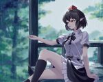  1girl arm_support black_bow black_bowtie black_hair black_skirt black_socks blurry blurry_background bow bowtie brown_eyes commentary day frilled_skirt frills from_side hat highres knee_up kneehighs mfng235717 outdoors parted_lips pointy_ears rain red_hat shameimaru_aya shirt short_hair signature sitting skirt socks solo tokin_hat touhou water_drop white_shirt 