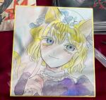  1girl :3 alternate_eye_color animal_ears blonde_hair blue_eyes cat_ears cat_girl cat_tail closed_mouth commentary dress hat highres kemonomimi_mode kz_m_i maribel_hearn mob_cap multiple_tails purple_dress shikishi short_hair solo tail touhou traditional_media two_tails white_background white_hat 