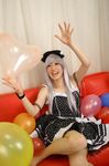  1girl balloon balloons bow cosplay couch dress hair_bow hairbow photo red_upholstery ribbon saya saya_(cosplayer) silver_hair 