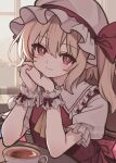  1girl ascot blonde_hair bright_pupils closed_mouth collared_shirt commentary_request crystal crystal_wings cup flandre_scarlet frilled_shirt_collar frills hat hat_ribbon highres long_hair looking_at_viewer mob_cap multicolored_wings one_side_up own_hands_clasped own_hands_together pointy_ears puffy_short_sleeves puffy_sleeves red_eyes red_vest ribbon shirt short_sleeves smile solo tea teacup touhou unfinished vest watermark white_hat white_pupils white_shirt white_wrist_cuffs wings wrist_cuffs yellow_ascot yuineko 