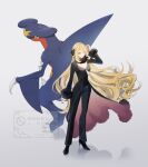 1girl black_coat black_pants black_sclera black_shirt blonde_hair breasts closed_mouth coat colored_sclera cynthia_(pokemon) fur-trimmed_coat fur-trimmed_sleeves fur_collar fur_trim garchomp grey_eyes hair_ornament hair_over_one_eye high_heels highres long_hair long_sleeves medium_breasts pants pokemon pokemon_(creature) pokemon_diamond/pearl/platinum sakaralalala sharp_teeth shirt simple_background smile teeth very_long_hair yellow_eyes 