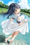  1girl absurdres ahoge artist_name black_hair blue_sky brown_eyes cloud commentary_request day dress dutch_angle eckert&amp;eich from_above from_behind full_body highres holding_own_dress kantai_collection lake light_rays looking_at_viewer looking_back outdoors sailor_dress sky smile solo sunbeam sunlight ushio_(kancolle) wading water white_dress 