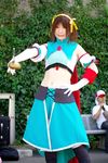  armband cape cosplay hair_ribbon hair_ribbons halter_top halterneck highres leggings midriff ousawa_karin photo ribbon suzumiya_haruhi suzumiya_haruhi_no_tomadoi suzumiya_haruhi_no_yuuutsu sword weapon 