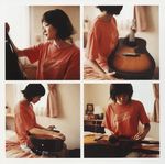  1girl a_piacere acoustic_guitar bed guitar highres instrument photo shirt shorts solo t-shirt tshirt ueno_juri 