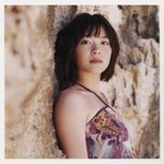  1girl a_piacere dress halterneck highres looking_at_viewer outdoors photo print_dress rock rocks solo ueno_juri 