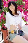  1girl asian crop_top croptop denim highres looking_at_viewer midriff nagasawa_nao photo shorts 