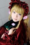  blonde_hair bonnet cosplay dress frills gown photo rozen_maiden ruffles shinku uni uni_(cosplayer) velvet 
