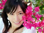  1girl asian croptop flower highres looking_at_viewer nagasawa_nao photo smile 