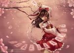  arm_up between_fingers bow branch brown_eyes brown_hair cherry_blossoms detached_sleeves floating floating_object gohei hair_bow hakurei_reimu highres long_hair mouth_hold ofuda petals pink pose reiashford solo touhou watermark web_address 