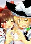  blonde_hair blush bow braid brown_eyes brown_hair detached_sleeves ema20 hair_bow hair_tubes hakurei_reimu hands_together hat heart heart_hands heart_hands_duo highres holding_hands kirisame_marisa long_hair multiple_girls one_eye_closed open_mouth smile touhou witch_hat 