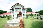  1girl asian brown_hair dress fountain looking_at_viewer looking_back outdoors photo rosebud solo sugimoto_yumi 