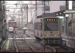  alternate_costume contemporary ground_vehicle japanese_flag kochiya_sanae moriya_suwako multiple_girls overhead_line pantograph railroad_crossing railroad_tracks real_world_location realistic sakura_sora scenery streetcar suitcase tokyo_(city) touhou train_station umbrella yasaka_kanako 