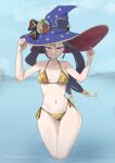  1girl bikini black_hair blue_background breasts crescent crescent_pin genshin_impact gold_bikini green_eyes hair_ornament highres long_hair mona_(genshin_impact) navel ocean original pointy_hat ramus5s smile solo stomach swimsuit teeth thighs twintails 