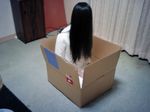  black_hair box cosplay crossgun curtains dress hair_over_eyes hair_over_face in_box in_container indoors long_hair photo sitting solo the_ring white_dress wood yamamura_sadako 