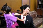  1boy 1girl ace_attorney ayasato_harumi ayasato_harumi_(cosplay) capcom child cosplay gyakuten_saiban lowres naruhodou_ryuuichi naruhodou_ryuuichi_(cosplay) photo slap slapping 