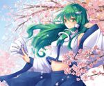  cherry_blossoms frog_hair_ornament green_eyes green_hair hair_ornament hair_tubes highres holding kochiya_sanae long_hair navel ofuda sakura_ran smile solo touhou 