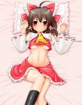  ahoge aosode ascot black_legwear blush bow breasts brown_hair cuffs detached_sleeves hair_bow hair_tubes hakurei_reimu handcuffs kneehighs looking_at_viewer lying navel on_back pillow red_eyes sidelocks skirt small_breasts solo touhou underboob 