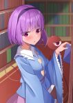  1girl :o absurdres arm_at_side blue_shirt blurry blurry_background blush bob_cut book bookshelf bright_pupils buttons commentary cowboy_shot frilled_shirt_collar frilled_sleeves frills from_side hand_up heart_button highres holding holding_book indoors kirisame_oreo komeiji_satori library long_sleeves looking_at_viewer nail_polish open_mouth pink_eyes pink_nails purple_hair shirt short_hair solo third_eye touhou tsurime wide_sleeves 