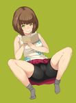  bare_shoulders bike_shorts book brown_hair cameltoe green_background green_eyes highres looking_at_viewer lying no_shoes on_back open_book original sabi_wasabi shiny shiny_skin short_hair simple_background skirt sleeveless smile socks solo spread_legs 