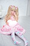 1girl blonde_hair brown_eyes chair hair_ornament japanese lolita_fashion photo solo sweet_lolita twintails 