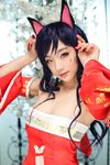  1girl ahri animal_ears black_hair cat_ears cosplay fox_ears korean league_of_legends long_hair photo red_eyes spiral_cats 