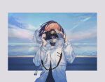  1girl bakushi_(kaeritai0609) blue_sky brown_hair camera covered_eyes highres holding holding_camera hood hooded_jacket jacket ocean original outdoors short_hair sky smile solo taking_picture white_jacket wind wind_lift 