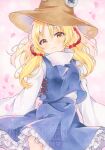  1girl blonde_hair blush brown_hat closed_mouth commentary falling_petals frilled_skirt frills hair_ribbon hashtag-only_commentary hat highres long_hair long_sleeves looking_at_viewer moriya_suwako petals pink_petals purple_skirt purple_vest red_ribbon ribbon skirt skirt_set smile solo touhou twitter_username vest watermark wide_sleeves yellow_eyes yuiki_(cube) 