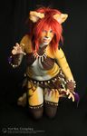  bodypaint clothed clothing cosplay ear_piercing feathers feline female hair leather mammal piercing red_hair skimpy tiger tribal_clothing yurikocosplay 