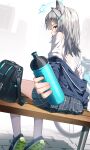  1girl absurdres animal_ears artist_name bag black_bag blue_archive blue_eyes blue_jacket blue_skirt bottle bra_visible_through_clothes commentary commentary_request cross_hair_ornament dutch_angle from_behind green_shoes grey_hair hair_ornament halo highres holding holding_bottle incoming_drink jacket looking_at_viewer maeru medium_hair on_bench pavement plaid_clothes plaid_skirt pleated_skirt shiroko_(blue_archive) shirt shoes sitting skirt socks solo sweat wet wet_clothes wet_shirt white_socks wolf_ears wolf_girl 