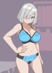  1girl 30-06 bedroom blue_bra blue_eyes blue_panties bob_cut bra breasts cleavage commentary contrapposto cowboy_shot grey_hair hair_ornament hair_over_one_eye hairclip hamakaze_(kancolle) hand_on_own_hip highres kantai_collection large_breasts looking_at_viewer panties short_hair solo underwear 