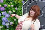  1girl asian breasts cleavage fat flower huge_breasts hydrangea luu_(cosplayer) photo red_hair solo umbrella 