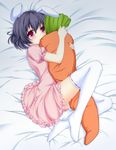  animal_ears black_hair blush bunny_ears carrot carrot_pillow colorized hug inaba_tewi itou_nanami lying noumin pillow puffy_sleeves red_eyes short_hair short_sleeves solo thighhighs touhou white_legwear 