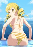  ass bikini blonde_hair blush cap_(dkdm-d) cloud day drill_hair hair_ornament long_hair looking_back mahou_shoujo_madoka_magica sky smile solo striped striped_bikini swimsuit tomoe_mami twin_drills twintails wading water yellow_bikini 