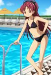  bikini blush bow breasts cap_(dkdm-d) chair cloud day hair_bow hand_on_hip leaning_forward long_hair lounge_chair mahou_shoujo_madoka_magica navel outdoors parasol ponytail pool pool_ladder poolside red_eyes red_hair sakura_kyouko sky small_breasts smile solo swimsuit umbrella water 