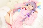  1girl asian bed cosplay crescent dress female hat long_hair patchouli_knowledge photo pillow purple_hair solo tenshi_myu touhou 