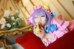  1girl asian cosplay couch cream crescent dessert dress female food hat long_hair patchouli_knowledge photo purple_hair solo tenshi_myu touhou 
