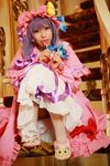  1girl asian candy cosplay crescent dress female hat highres lollipop long_hair patchouli_knowledge photo purple_hair solo tenshi_myu touhou 
