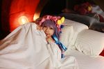  1girl asian bed blanket cosplay crescent dress female hat long_hair patchouli_knowledge photo pillow purple_hair solo tenshi_myu touhou 