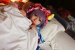  1girl asian bed blanket cosplay crescent dress female hat long_hair patchouli_knowledge photo pillow purple_hair solo tenshi_myu touhou 