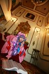 1girl asian cosplay couch crescent dress female hat highres long_hair patchouli_knowledge photo purple_hair solo tenshi_myu touhou 