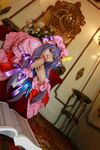  1girl asian bow carpet chandelier cosplay couch crescent dress female hat highres long_hair mirror mob_cap patchouli_knowledge photo purple_hair red_upholstery ribbon robe solo table tenshi_myu thighhighs touhou 