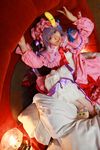  1girl asian cosplay couch crescent dress female hat highres long_hair patchouli_knowledge photo purple_hair solo tenshi_myu touhou 