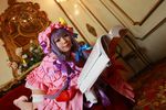  1girl asian cosplay couch crescent dress female hat long_hair patchouli_knowledge photo purple_hair solo tenshi_myu touhou 