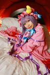  1girl asian bed blanket cosplay crescent dress female hat highres long_hair patchouli_knowledge photo pillow purple_hair solo tenshi_myu touhou 