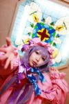  1girl asian cosplay crescent dress female flower hat highres long_hair patchouli_knowledge photo purple_hair solo tenshi_myu touhou window 