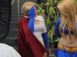  2girls animated_gif blonde_hair cape cosplay dc_comics photo power_girl spandex supergirl 