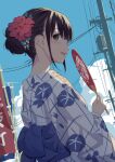  1girl a-senmei black_hair brown_eyes day flower from_behind hair_bun hair_flower hair_ornament hand_fan highres holding holding_fan japanese_clothes kanzashi kimono long_sleeves looking_back looking_to_the_side open_mouth original outdoors paper_fan sky solo uchiwa yukata 